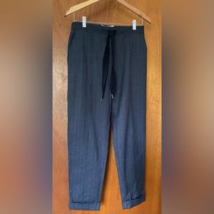 Ribbon tie business pants with a purple/blue pinstripe.